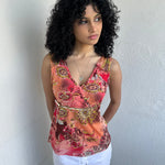 Woman wearing a Y2K 00s Pink & Orange Floral Mesh Tank with sequin detail