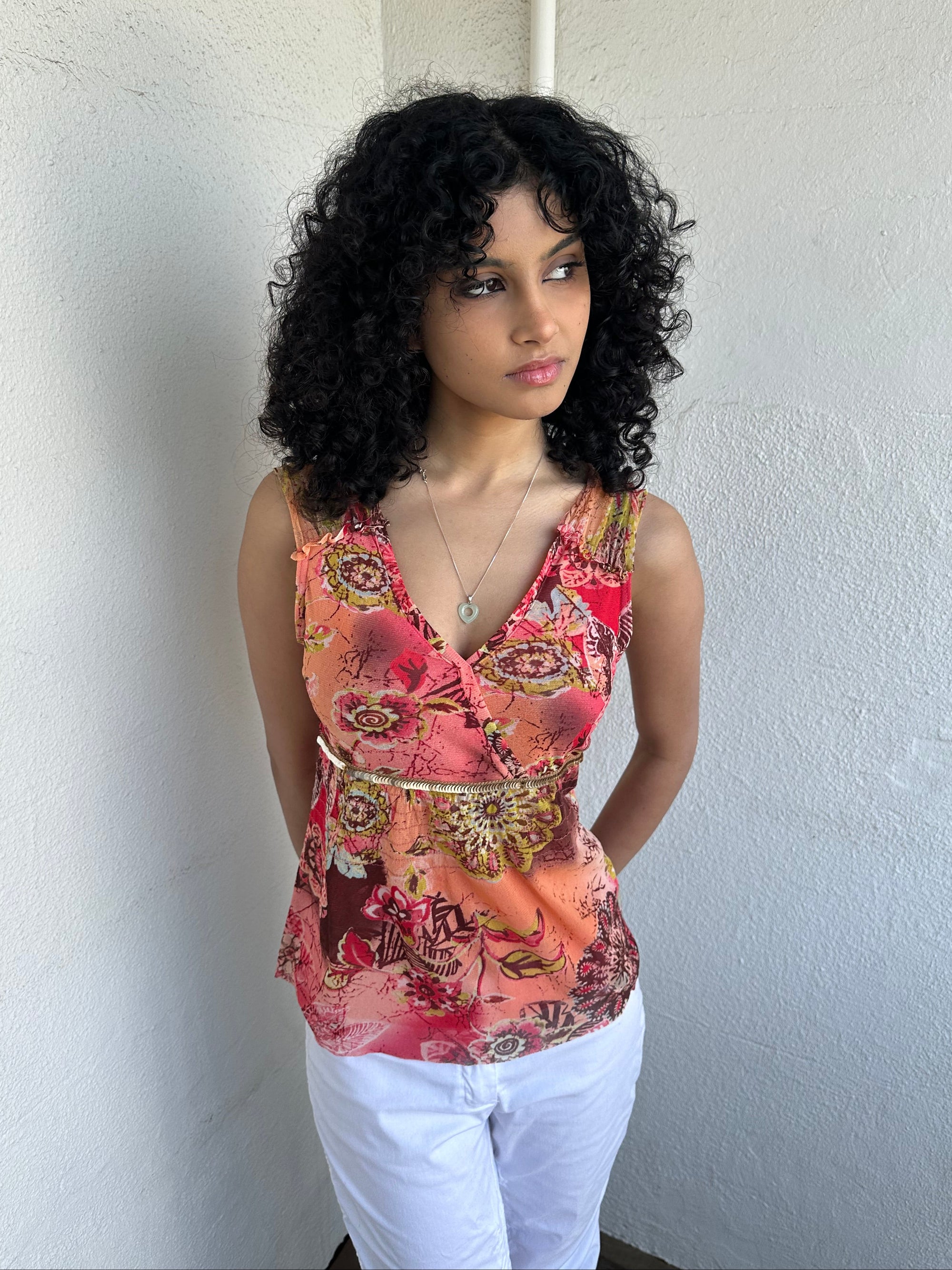 Woman wearing a Y2K 00s Pink & Orange Floral Mesh Tank with sequin detail