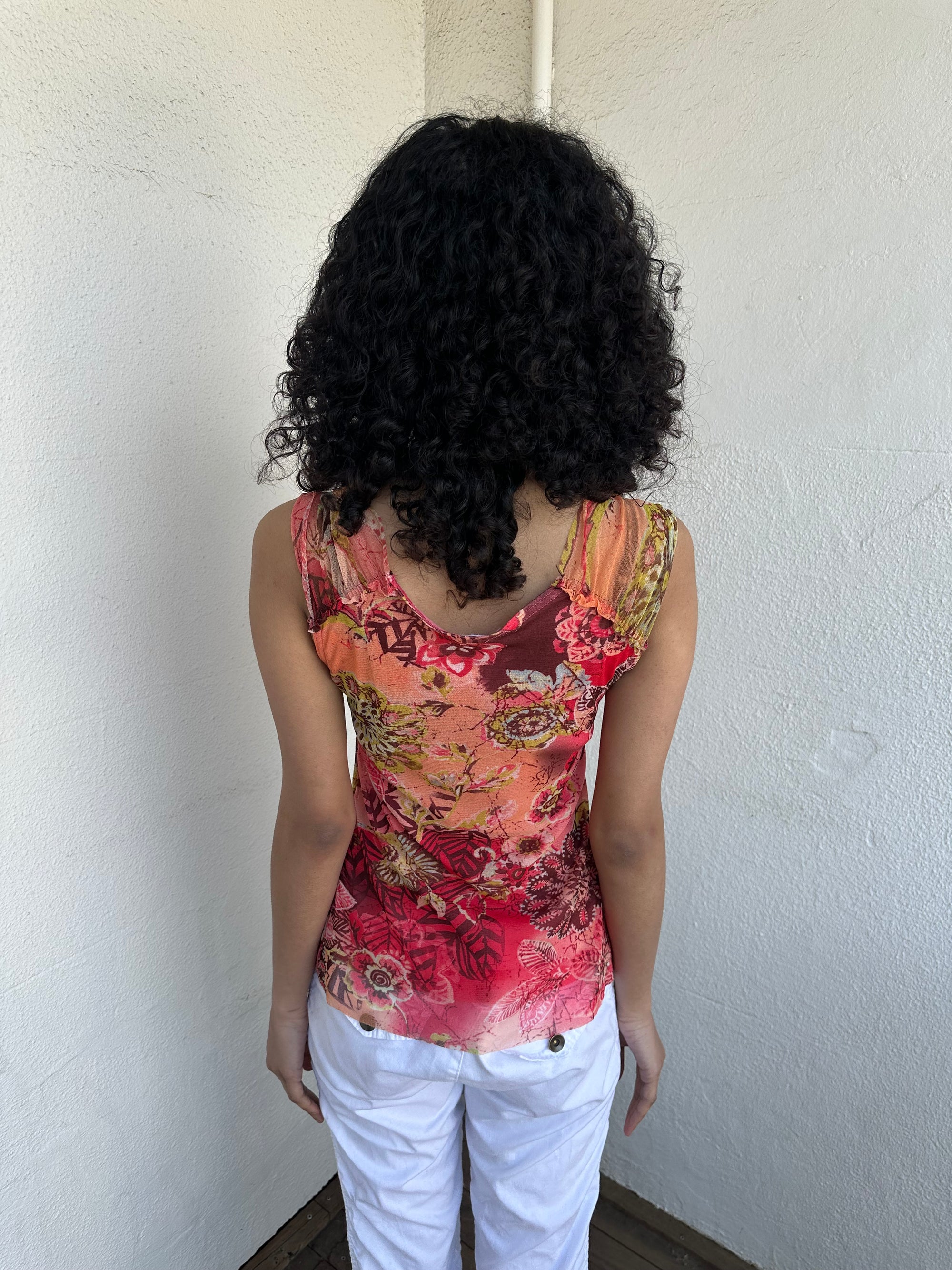 Woman wearing a Y2K 00s Pink & Orange Floral Mesh Tank with sequin detail
