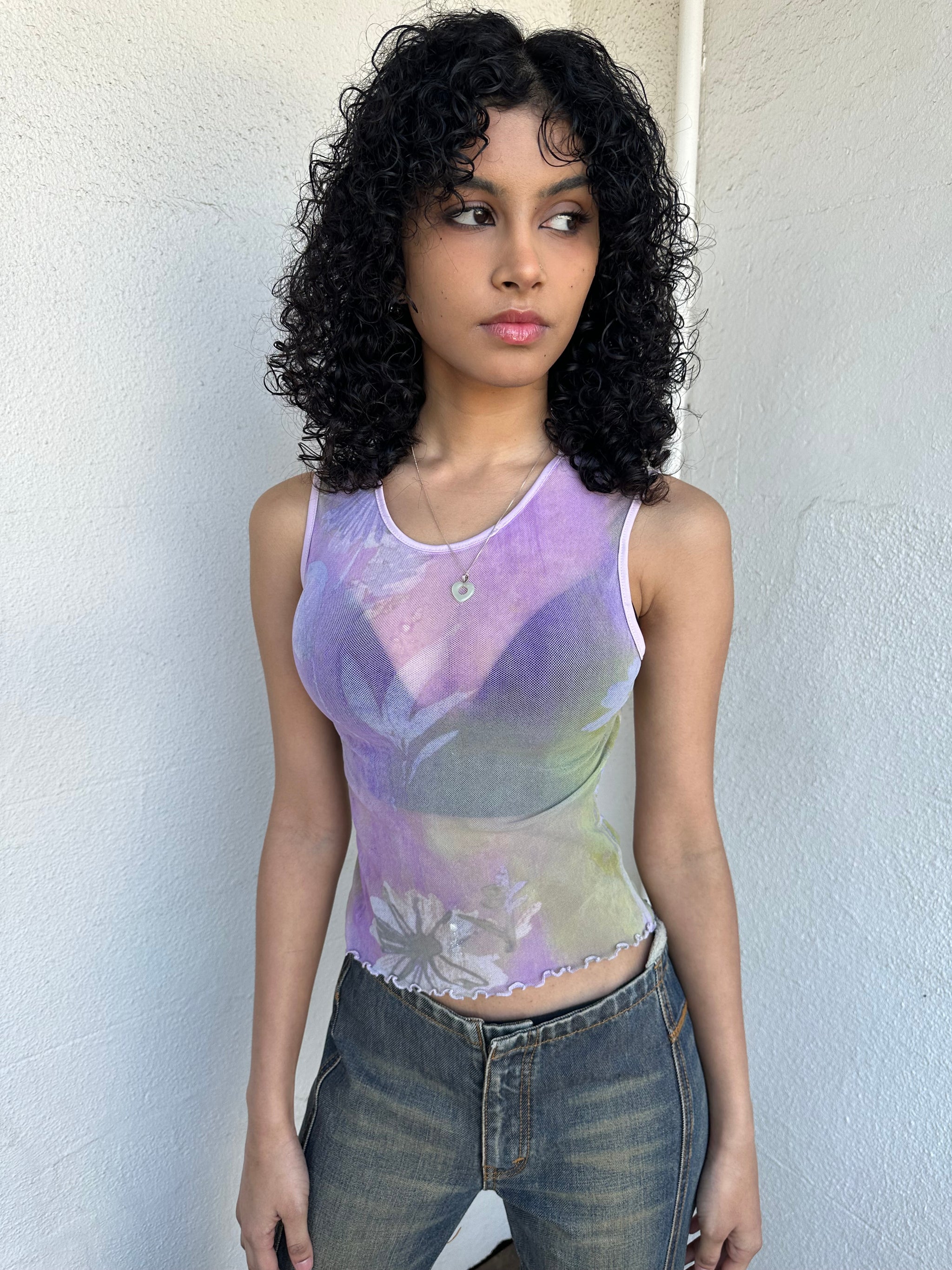 Purple and green flower print mesh tank that’s fully sheer with a soft, lightweight feel. 