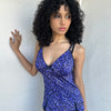Woman wearing a Y2K 90s Purple leopard print cami with a soft, lightweight feel and slim fit.