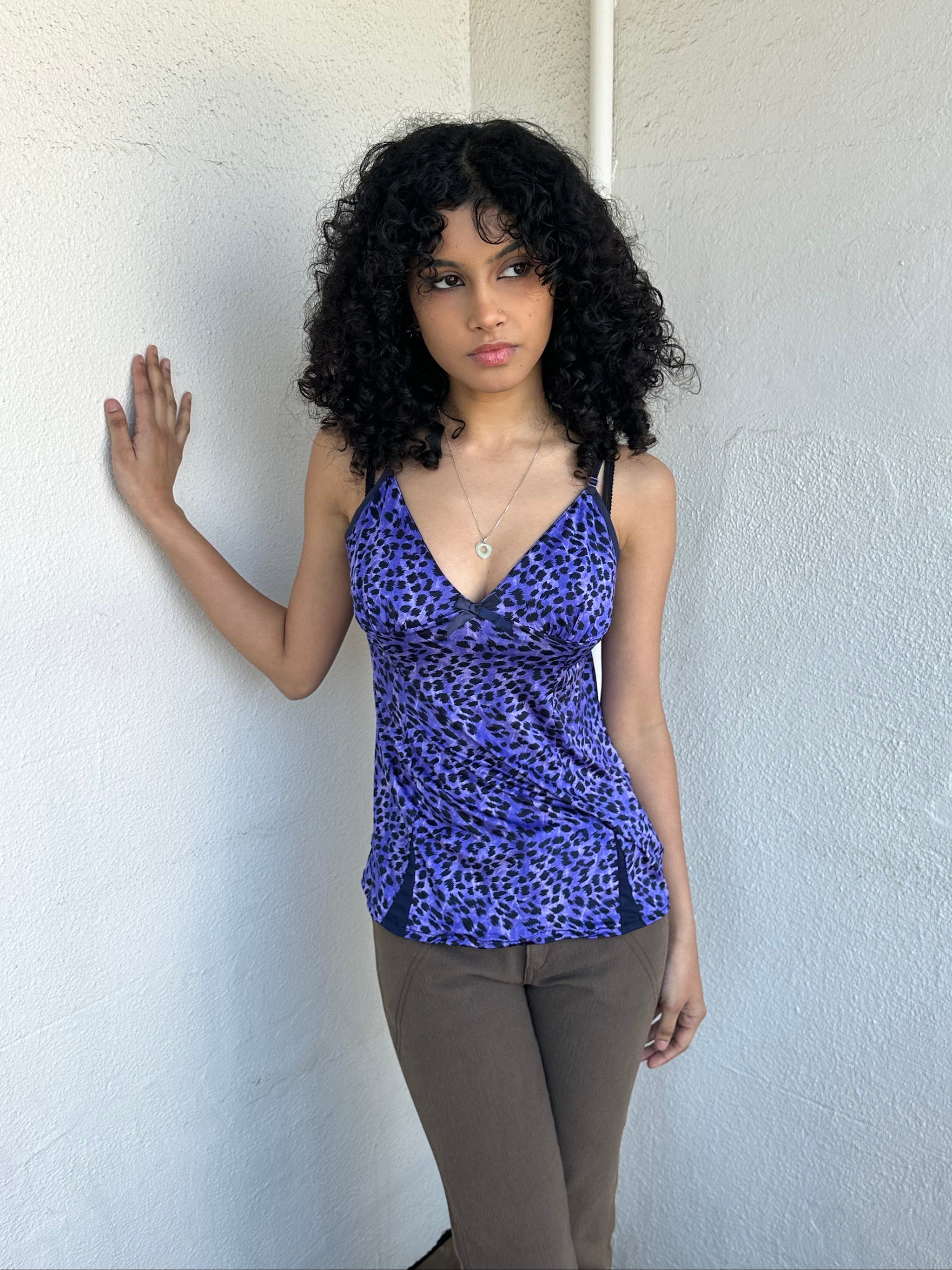 Woman wearing a Y2K 90s Purple leopard print cami with a soft, lightweight feel and slim fit.