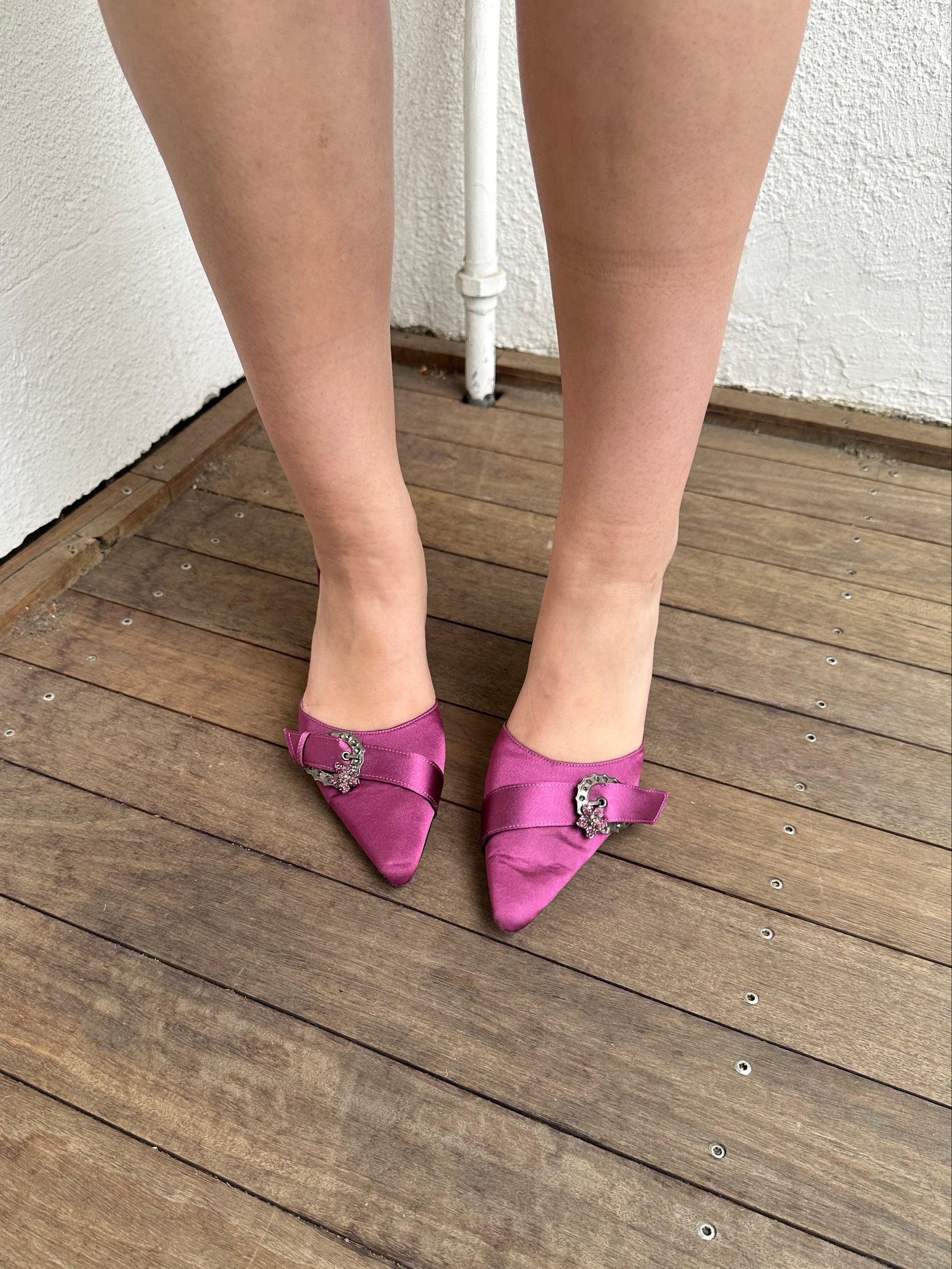Woman Dressed in Y2K 00s pink, purple satin kitten heels featuring a sleek satin finish in a rich purple tone