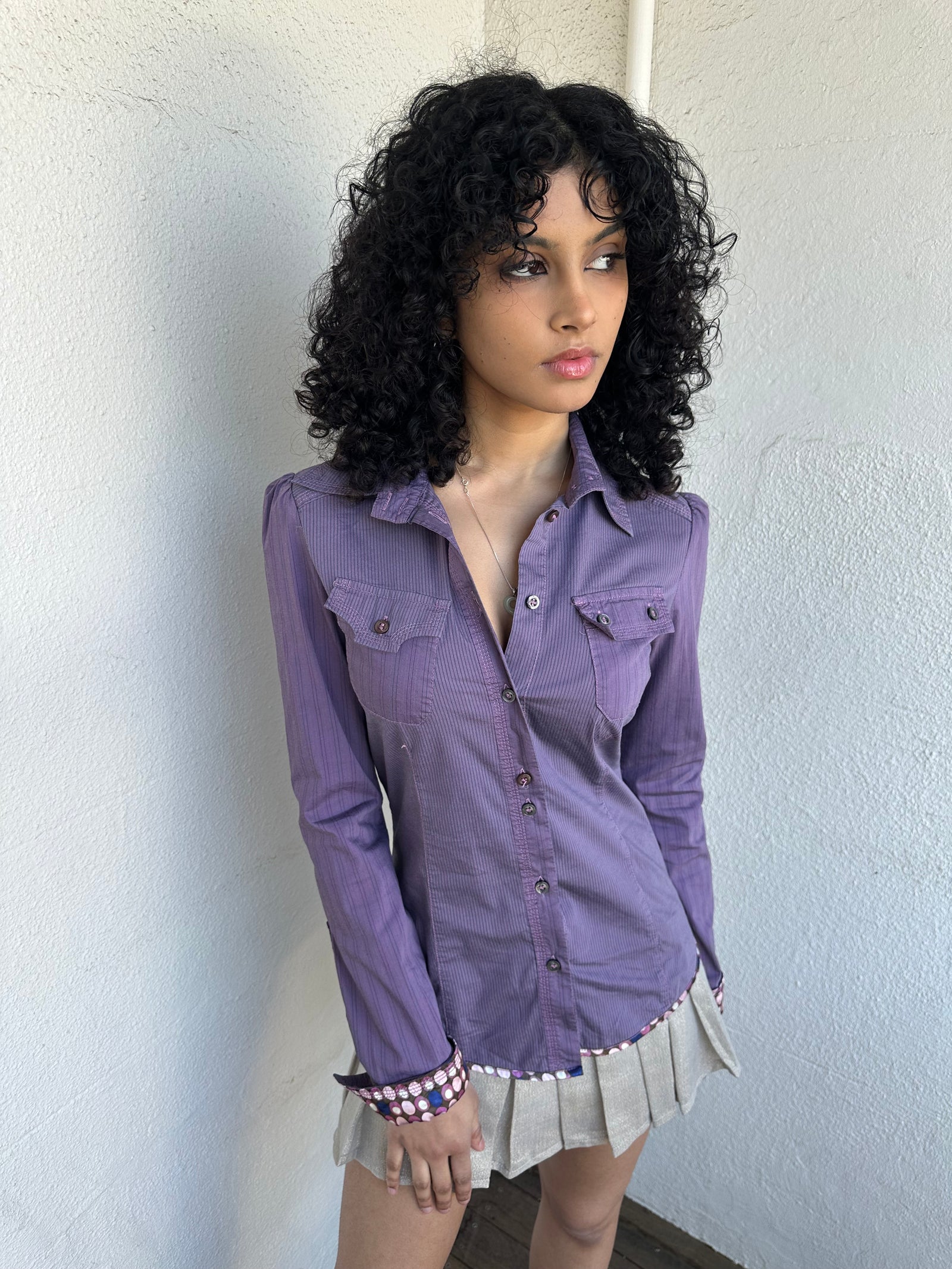 Woman wearing a Y2K 00s Purple stripe and polkadot shirt, pinstripe fabric with contrasting polkadot cuffs and trim hem