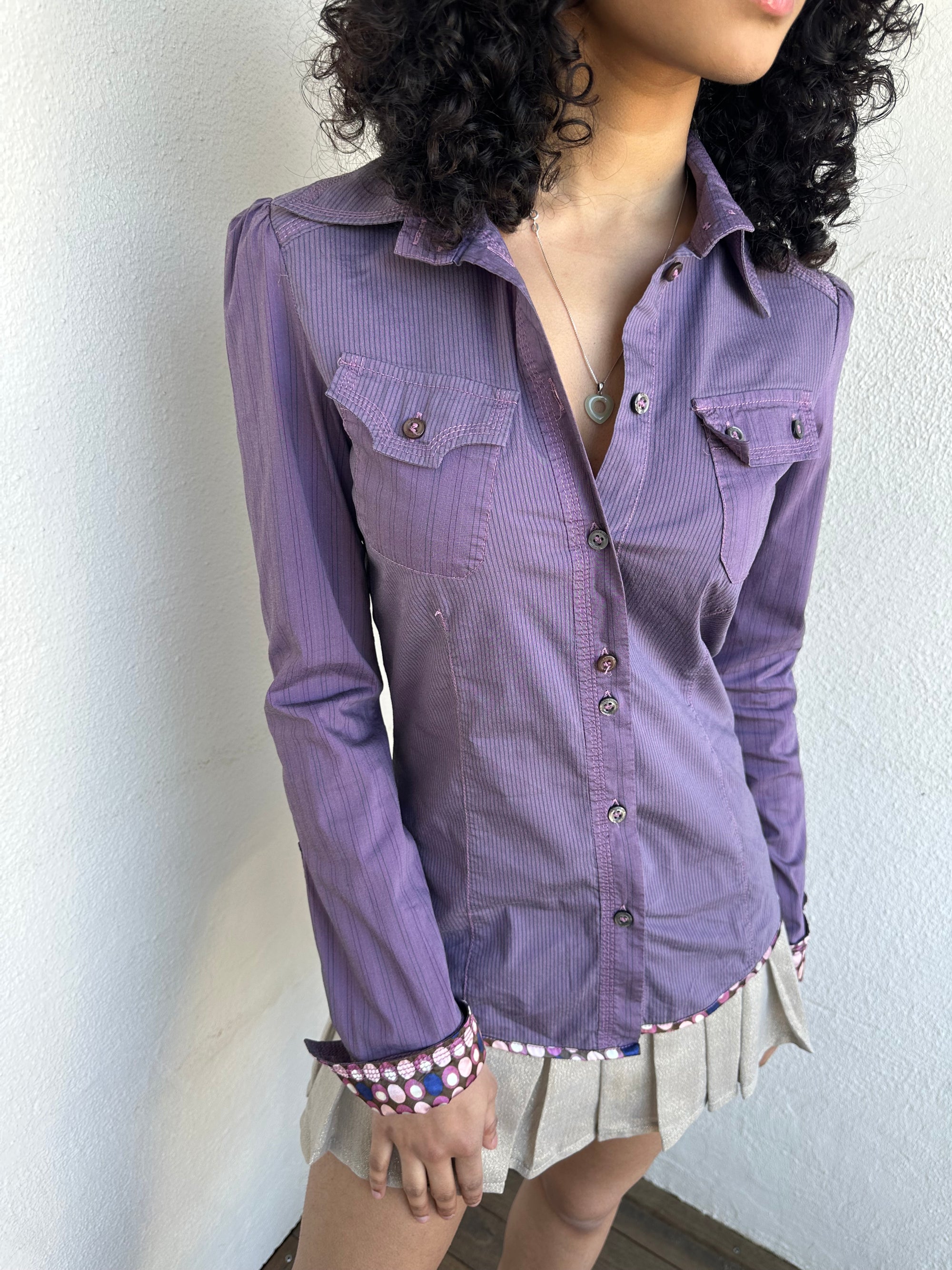 Woman wearing a Y2K 00s Purple stripe and polkadot shirt, pinstripe fabric with contrasting polkadot cuffs and trim hem