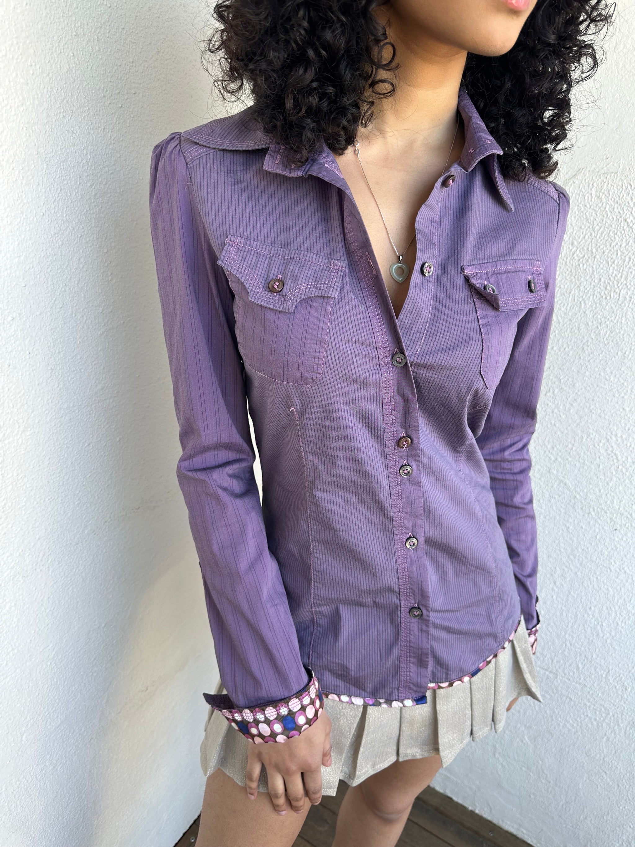 Woman wearing a Y2K 00s Purple stripe and polkadot shirt, pinstripe fabric with contrasting polkadot cuffs and trim hem
