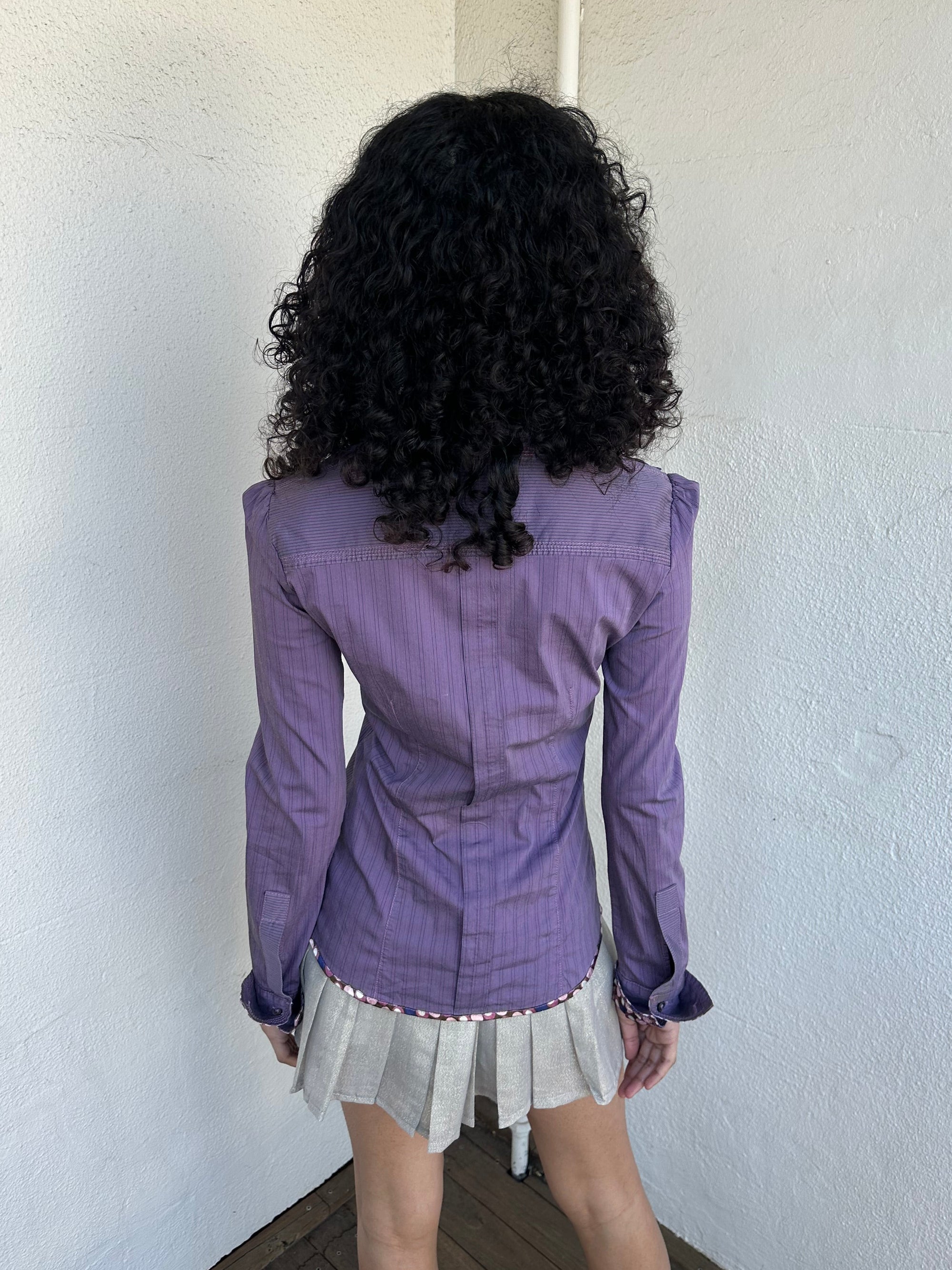 Woman wearing a Y2K 00s Purple stripe and polkadot shirt, pinstripe fabric with contrasting polkadot cuffs and trim hem