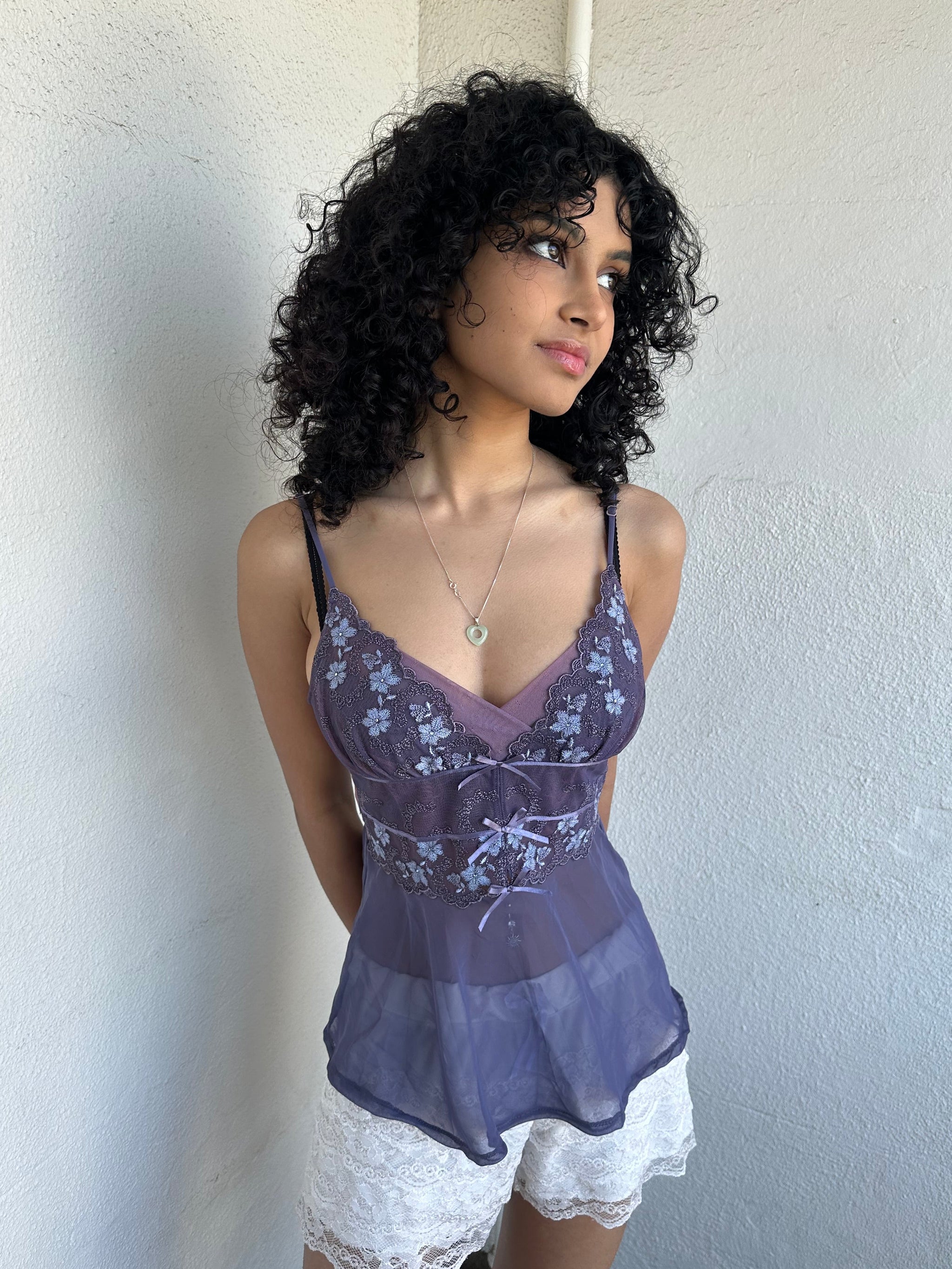 Woman wearing a Y2K 00s Purple Embroidered Fairy Cami top