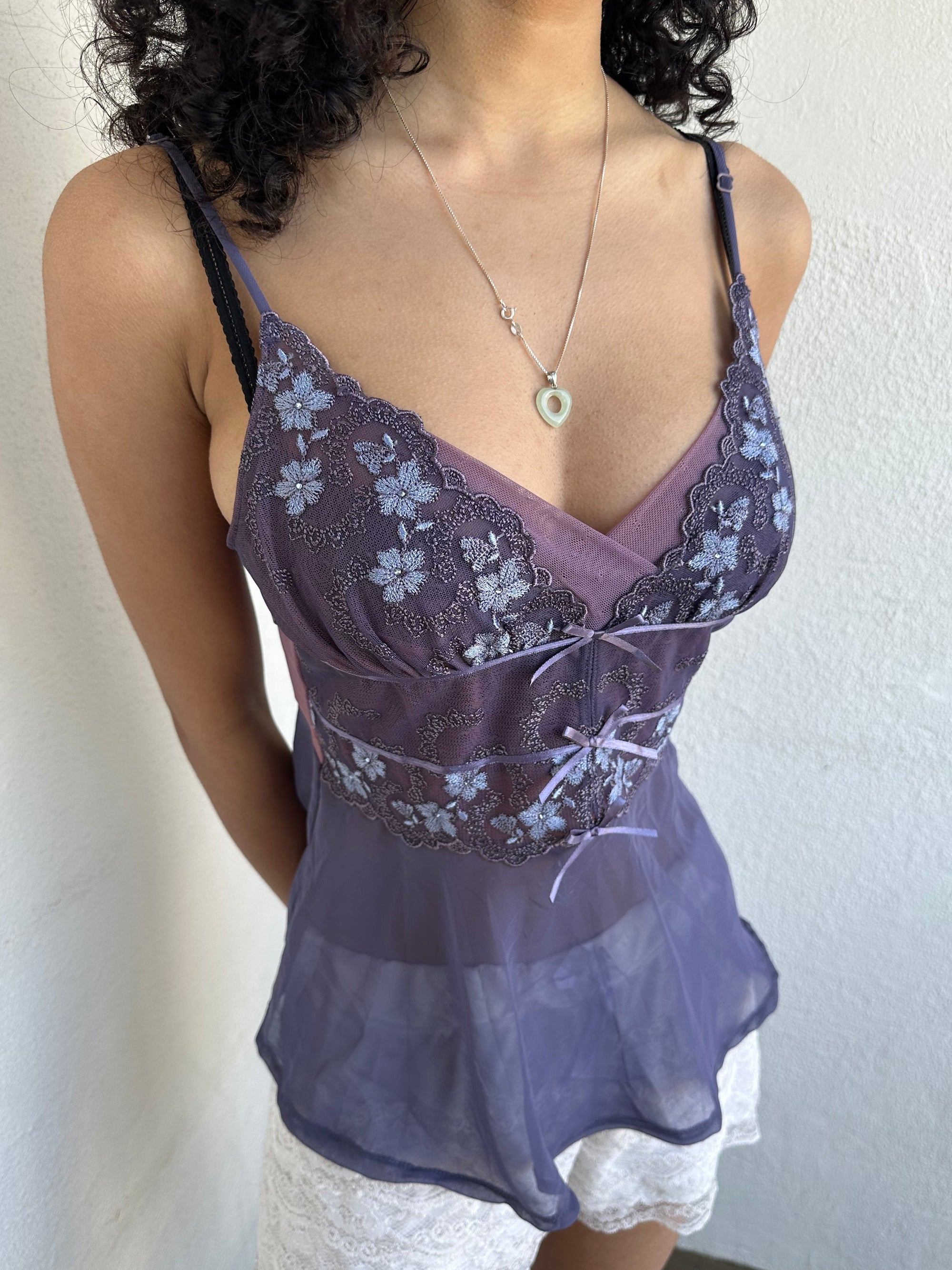 Woman wearing a Y2K 00s Purple Embroidered Fairy Cami top