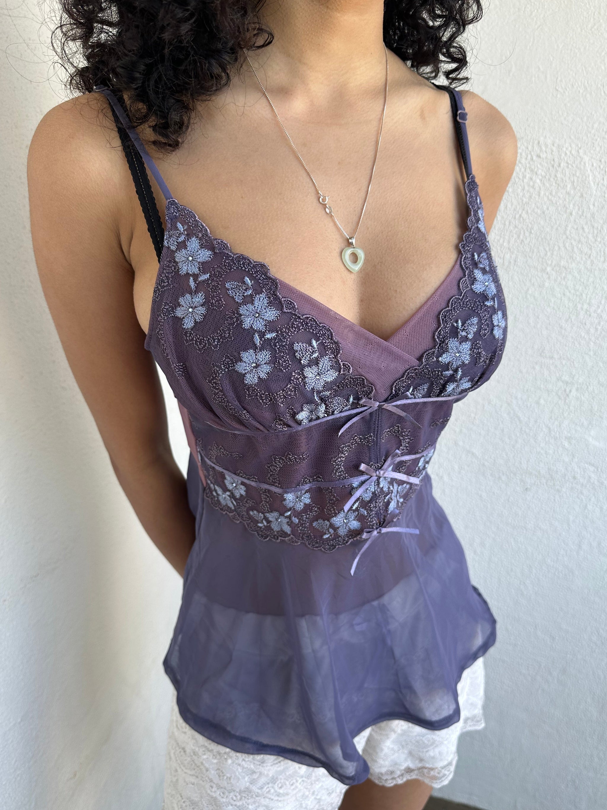 Woman wearing a Y2K 00s Purple Embroidered Fairy Cami top