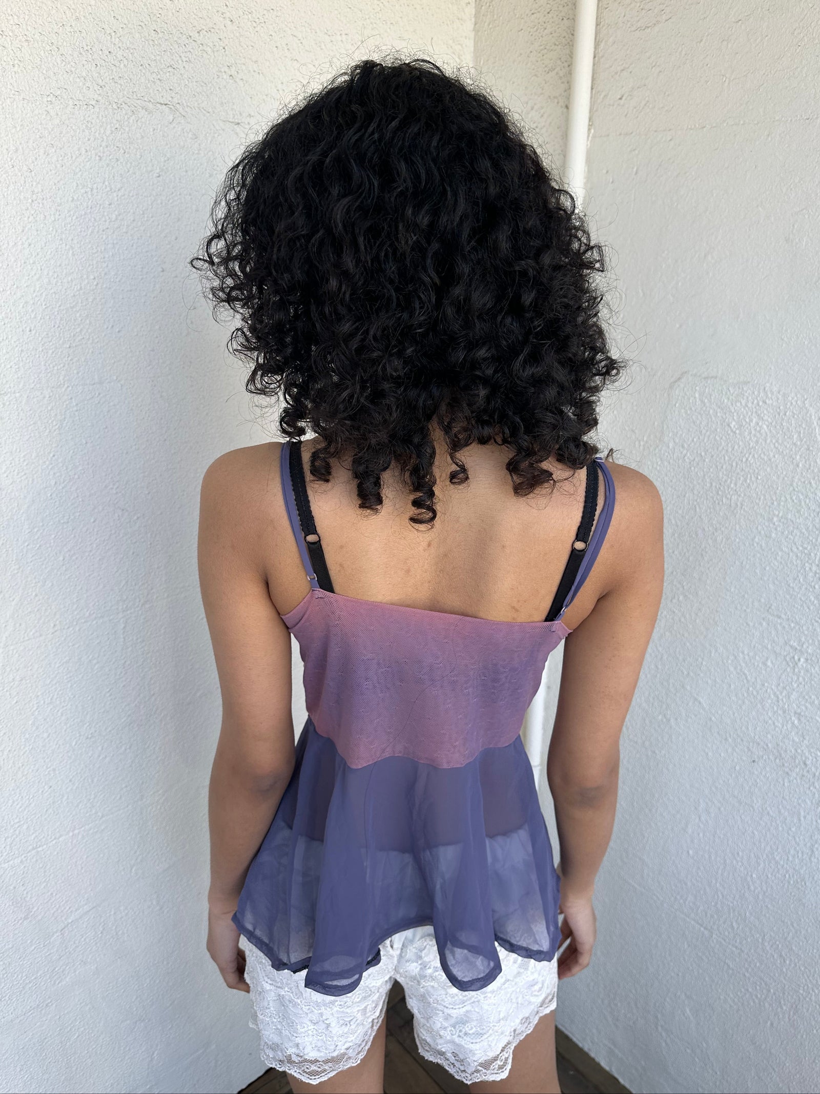 Woman wearing a Y2K 00s Purple Embroidered Fairy Cami top