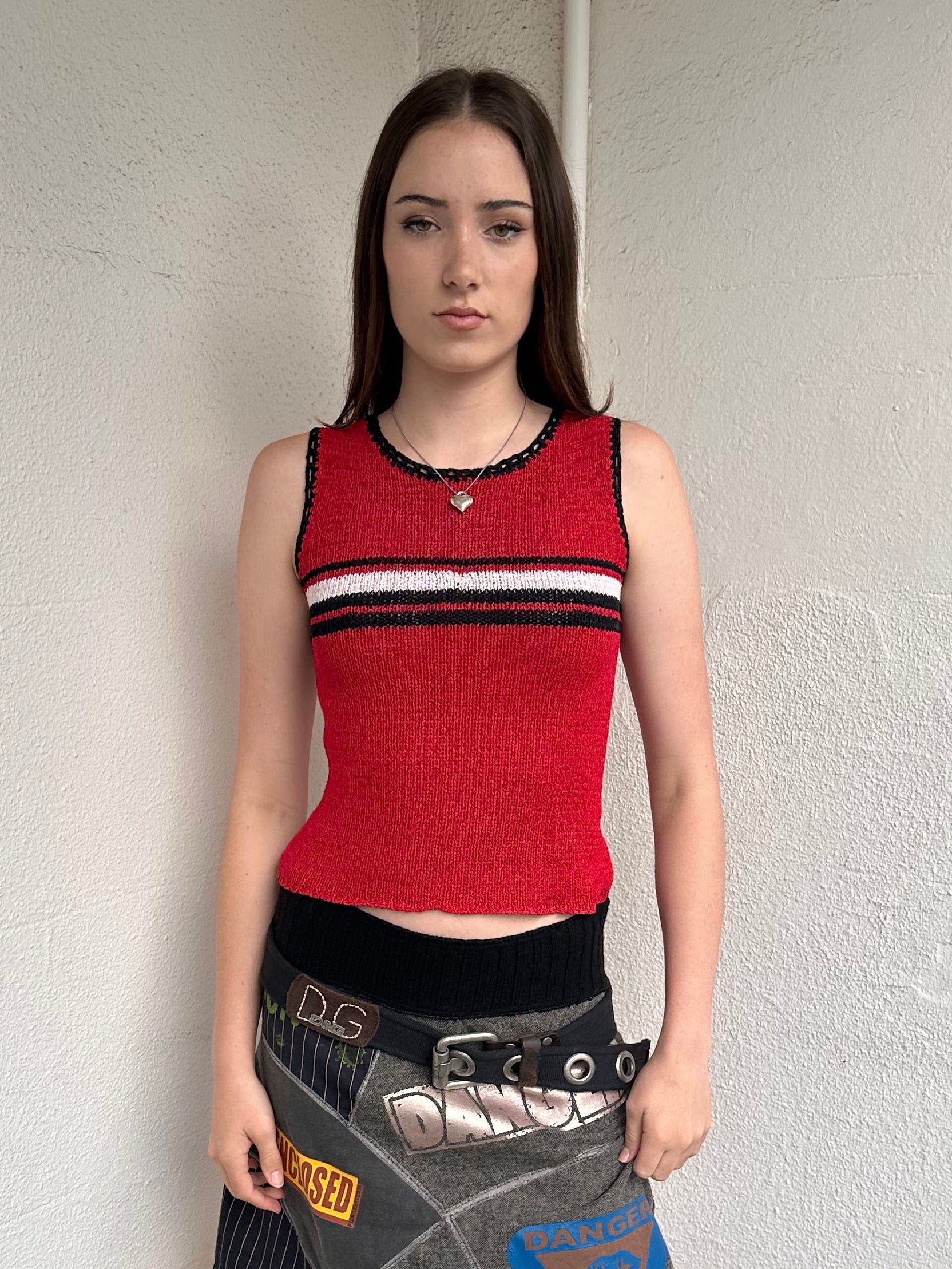 Woman wearing a Y2K 00s Black with white floral embroidery mesh cami top. Light blue floral embroidery featured 