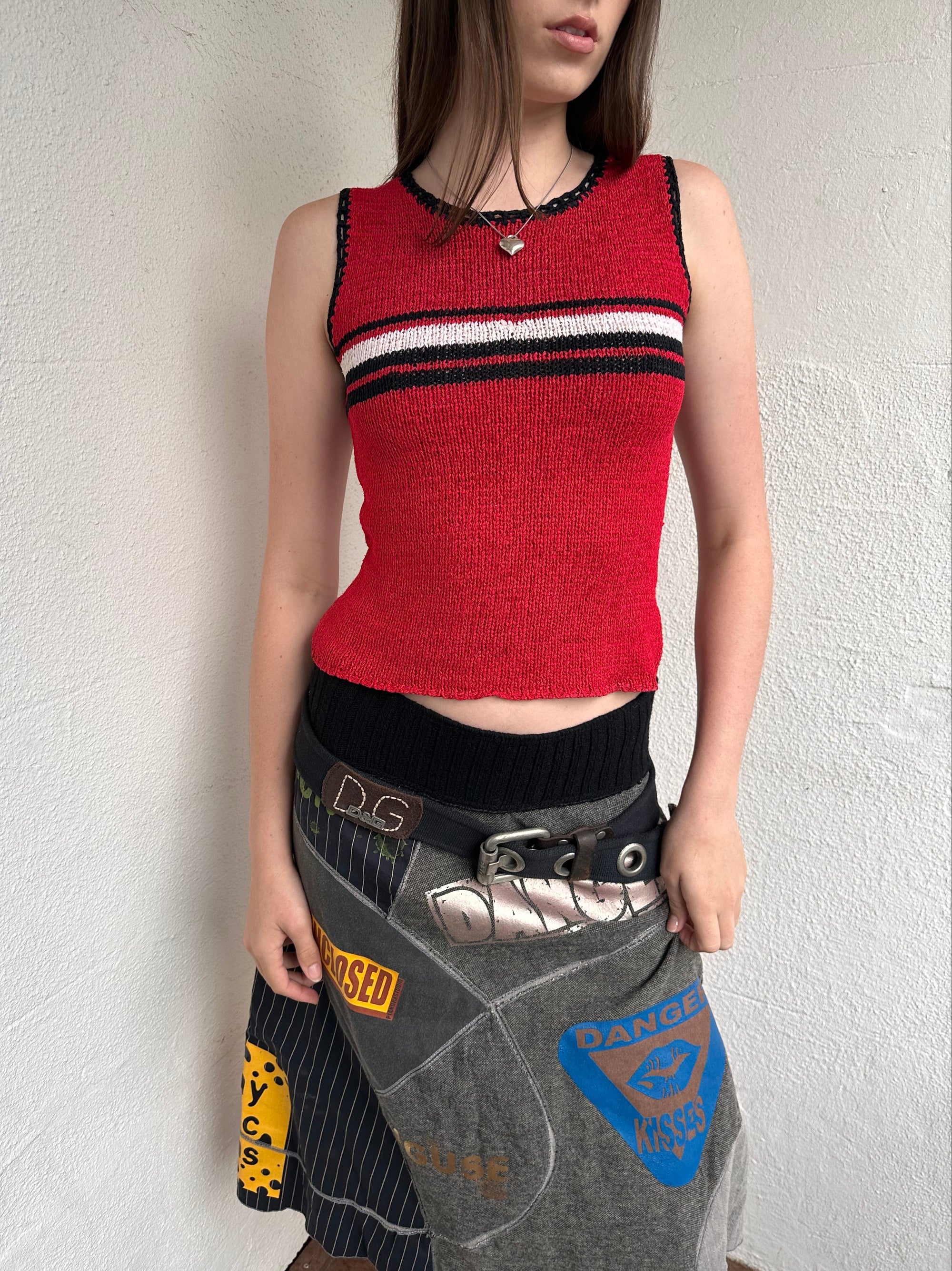 Woman wearing a Y2K 00s Black with white floral embroidery mesh cami top. Light blue floral embroidery featured 