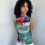 Women wearing a 00s Y2K Red, green, white and blue floral patchwork tank top in a sleeveless high-neck mesh design. 