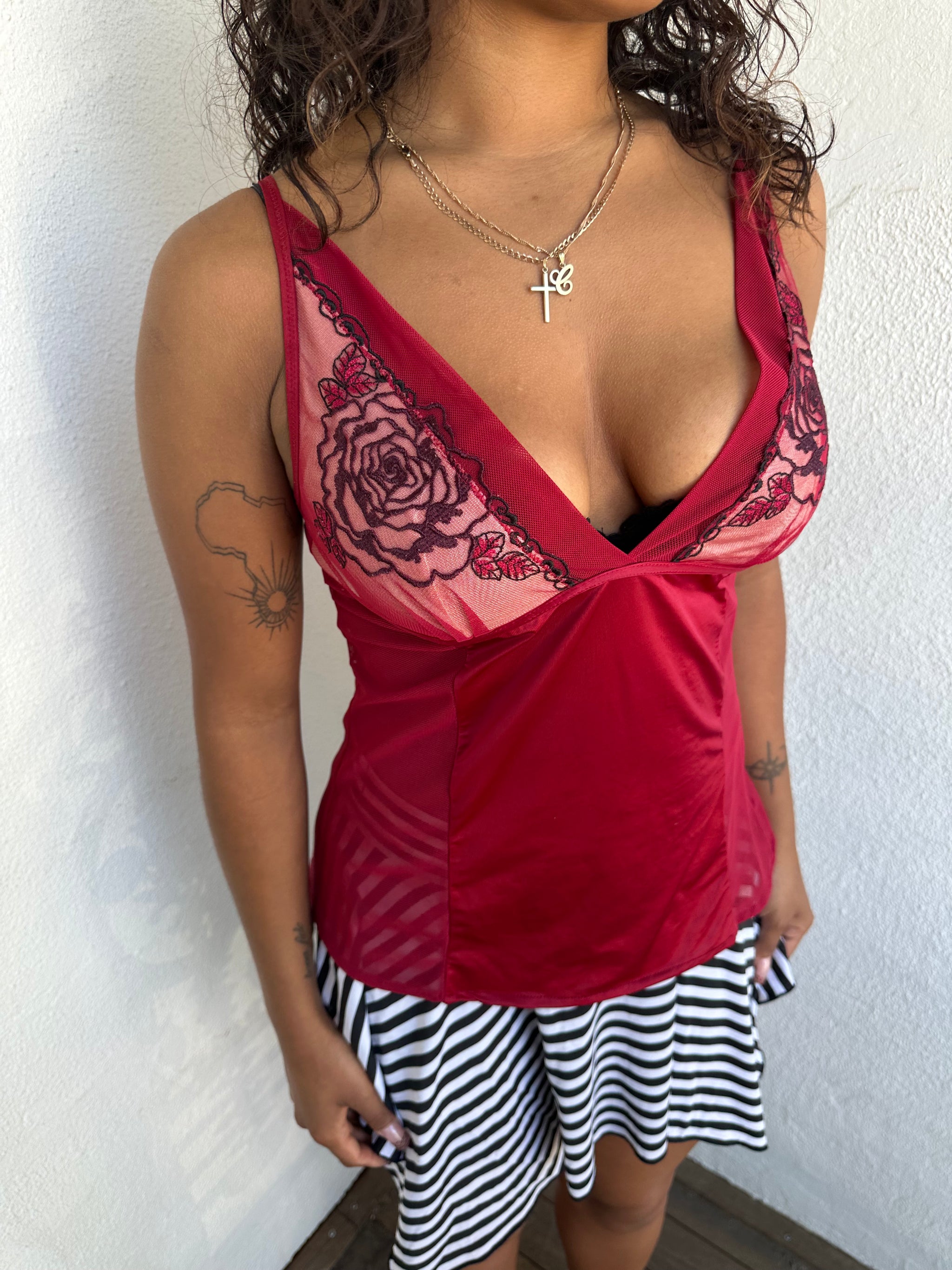 Woman Dressed in Y2K 00s Red mesh panel cami featuring sheer mesh panels along the sides and an embroidered bust 