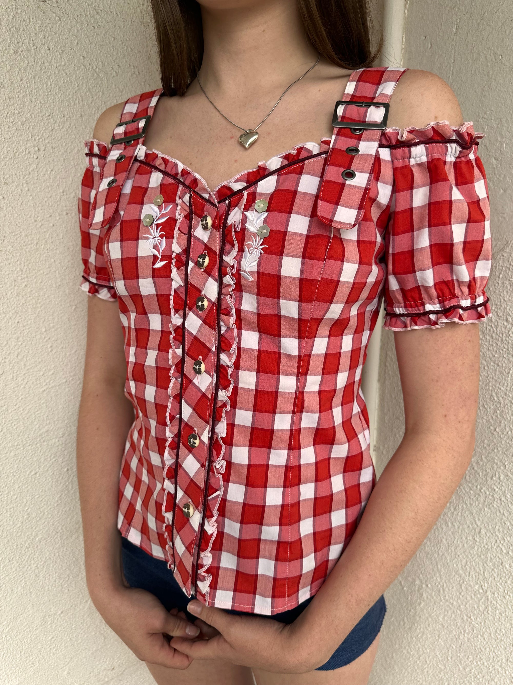 Women wearing a 00s Y2K Red and white checkered blouse with an off-the-shoulder design and chunky buckle straps. 