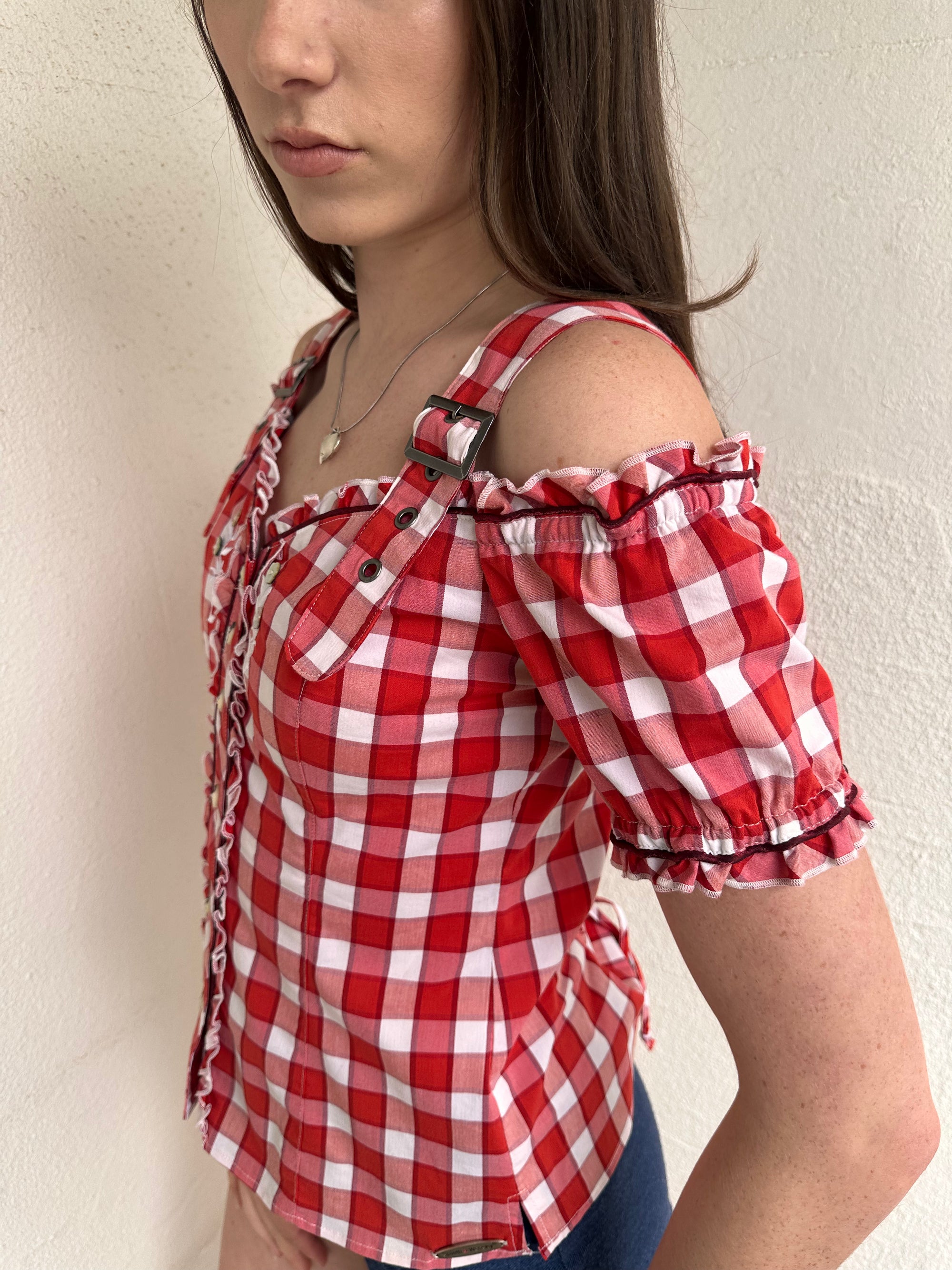 Women wearing a 00s Y2K Red and white checkered blouse with an off-the-shoulder design and chunky buckle straps. 