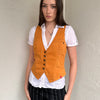 Woman wearing a Y2K 00s Rusty orange waistcoat with a fitted, tailored shape and stitching detail