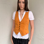 Woman wearing a Y2K 00s Rusty orange waistcoat with a fitted, tailored shape and stitching detail