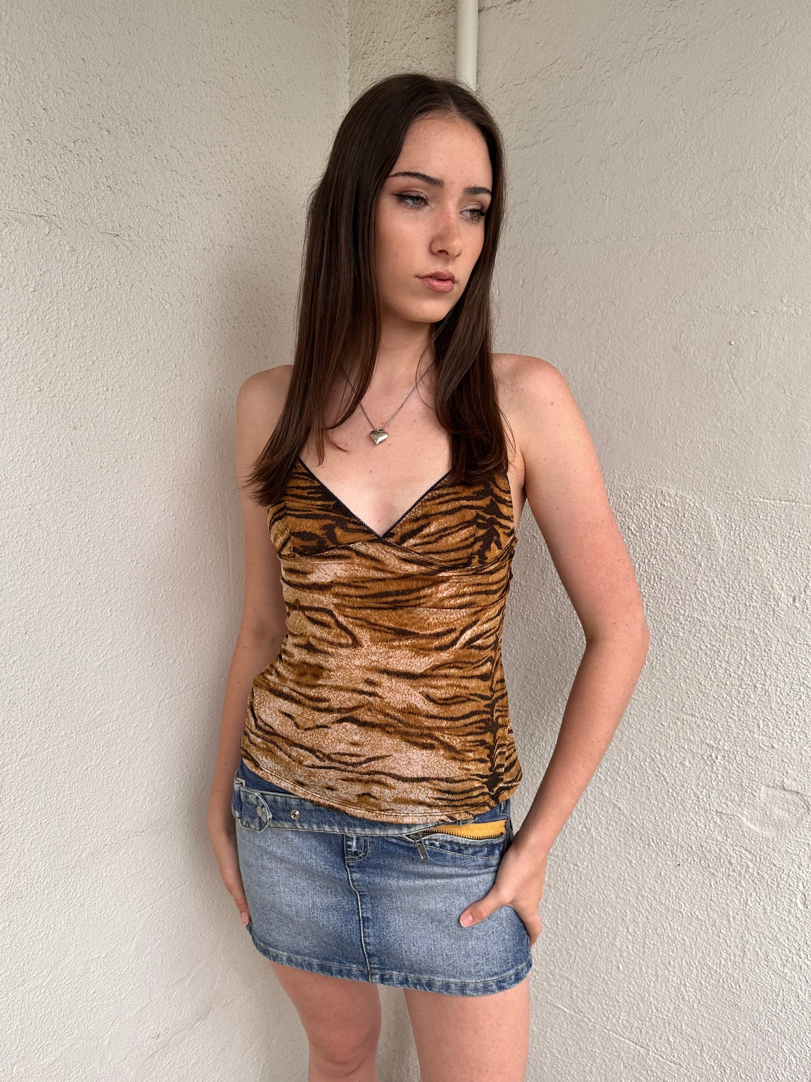 Women wearing a 00s Y2K Brown and black tiger print cami top with a sleek, fitted cut and soft stretch fabric.