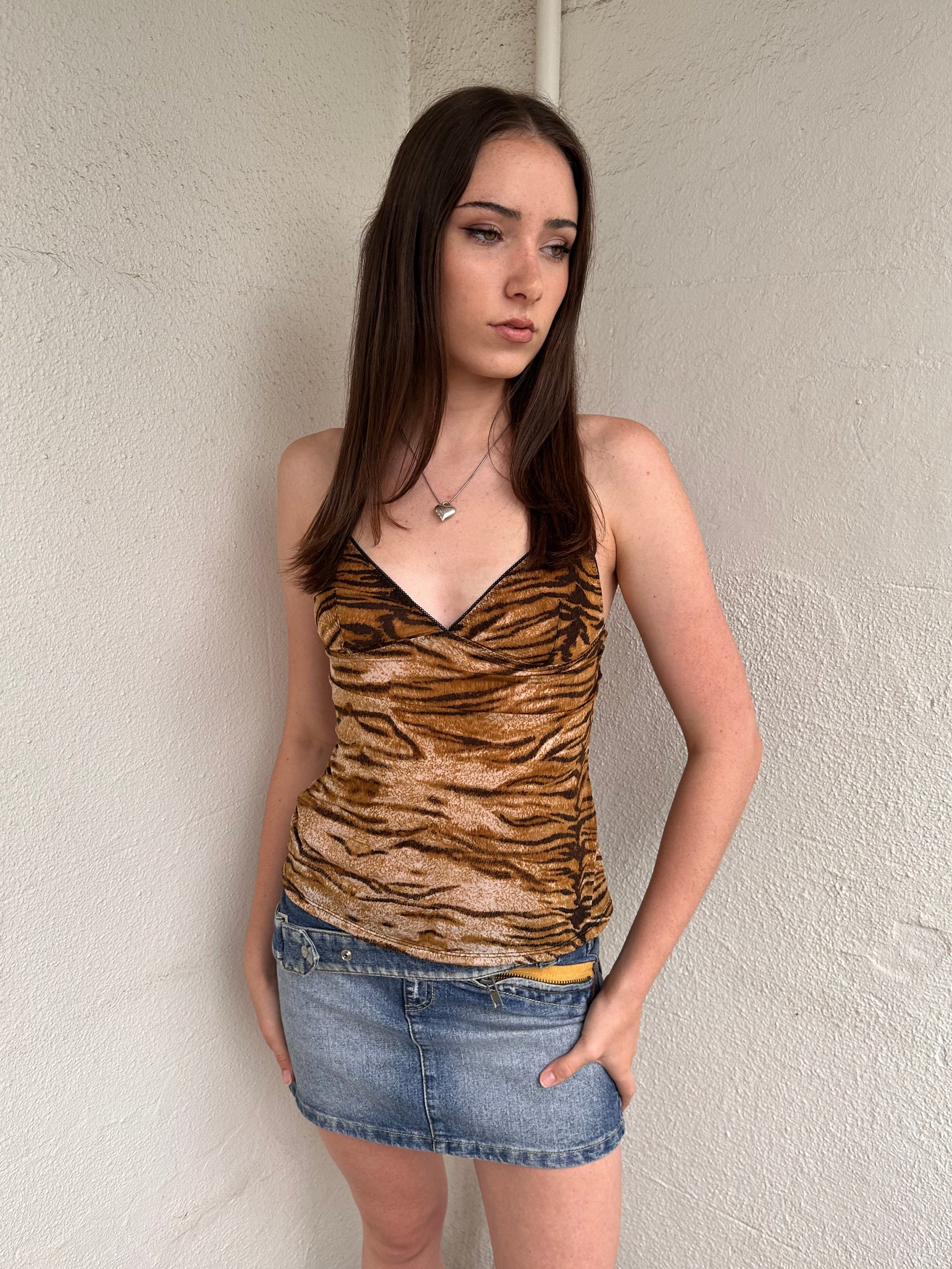 Women wearing a 00s Y2K Brown and black tiger print cami top with a sleek, fitted cut and soft stretch fabric.