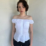 Woman Dressed in Y2K Reworked vintage shirt transformed into a summer classic white with black polka dot milkmaid style top 