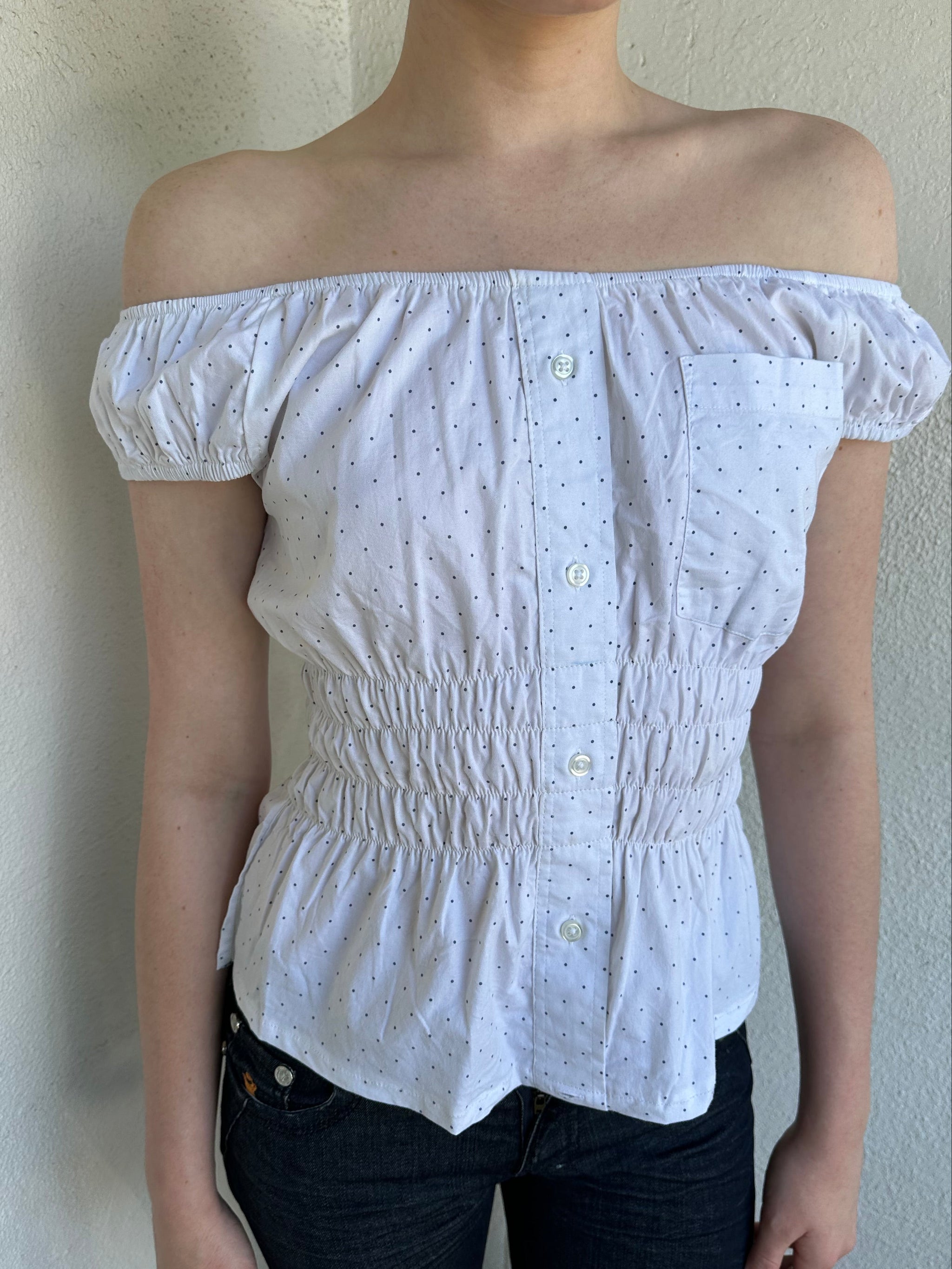 Woman Dressed in Y2K Reworked vintage shirt transformed into a summer classic white with black polka dot milkmaid style top 