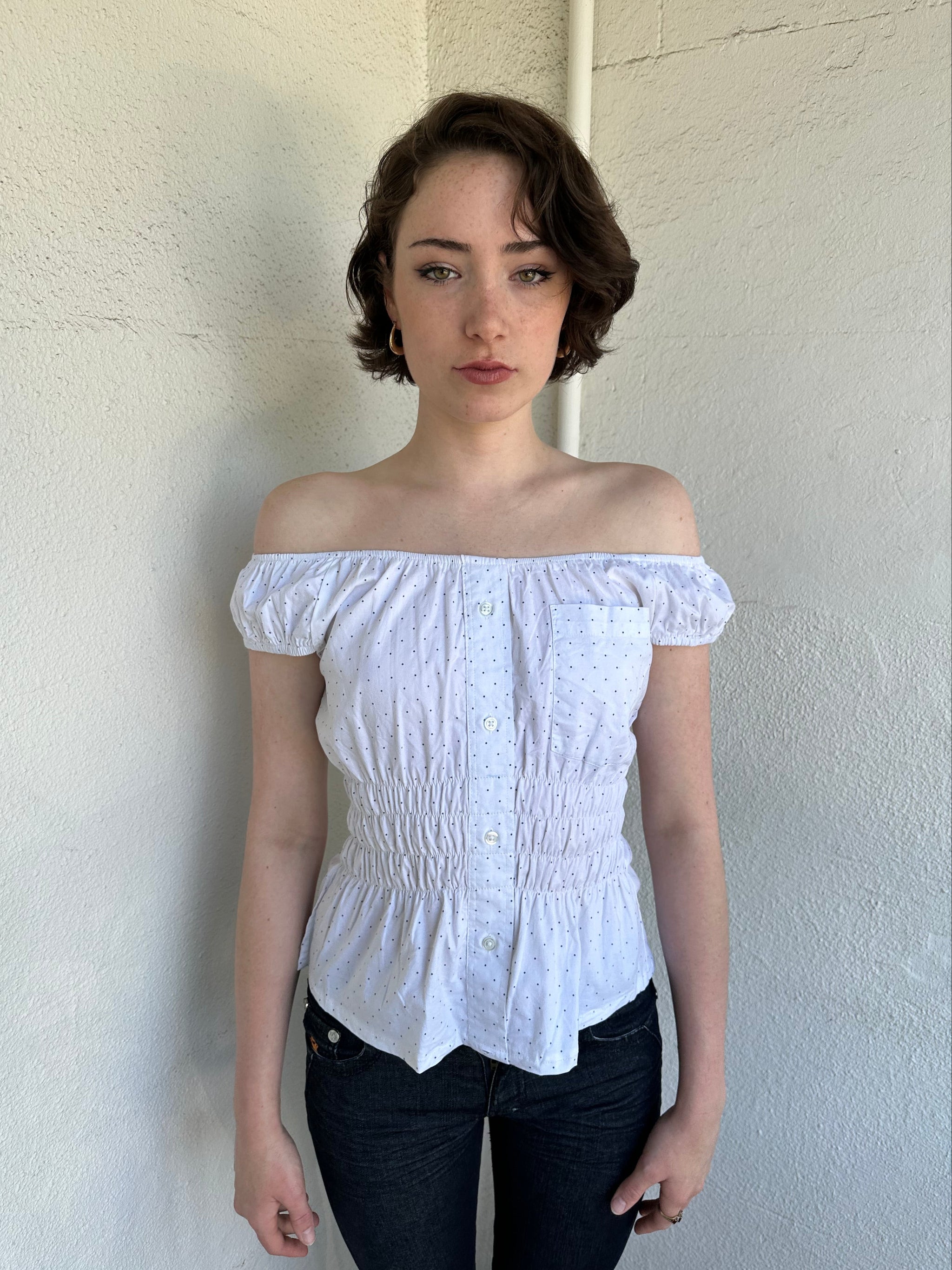 Woman Dressed in Y2K Reworked vintage shirt transformed into a summer classic white with black polka dot milkmaid style top 