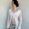 Woman Dressed in Y2K White crochet tie front cardigan featuring a layered bust design

