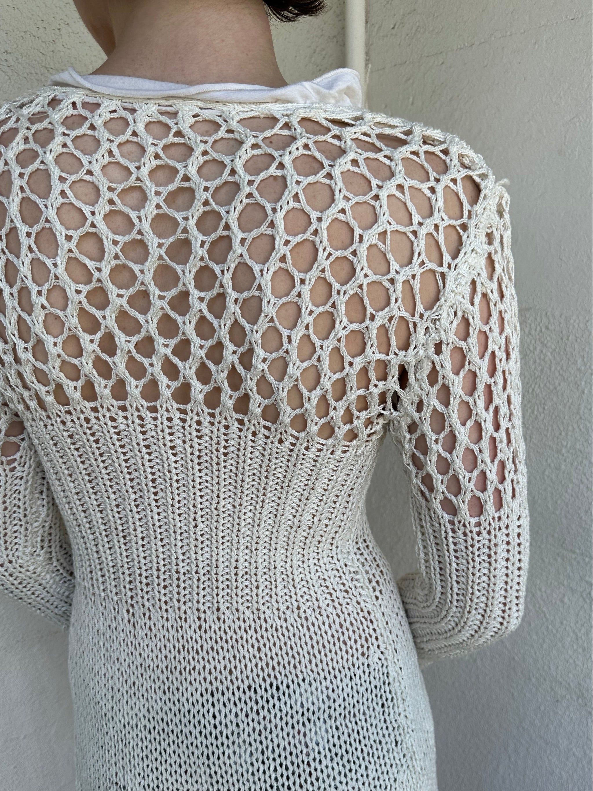 Woman Dressed in Y2K White crochet tie front cardigan featuring a layered bust design