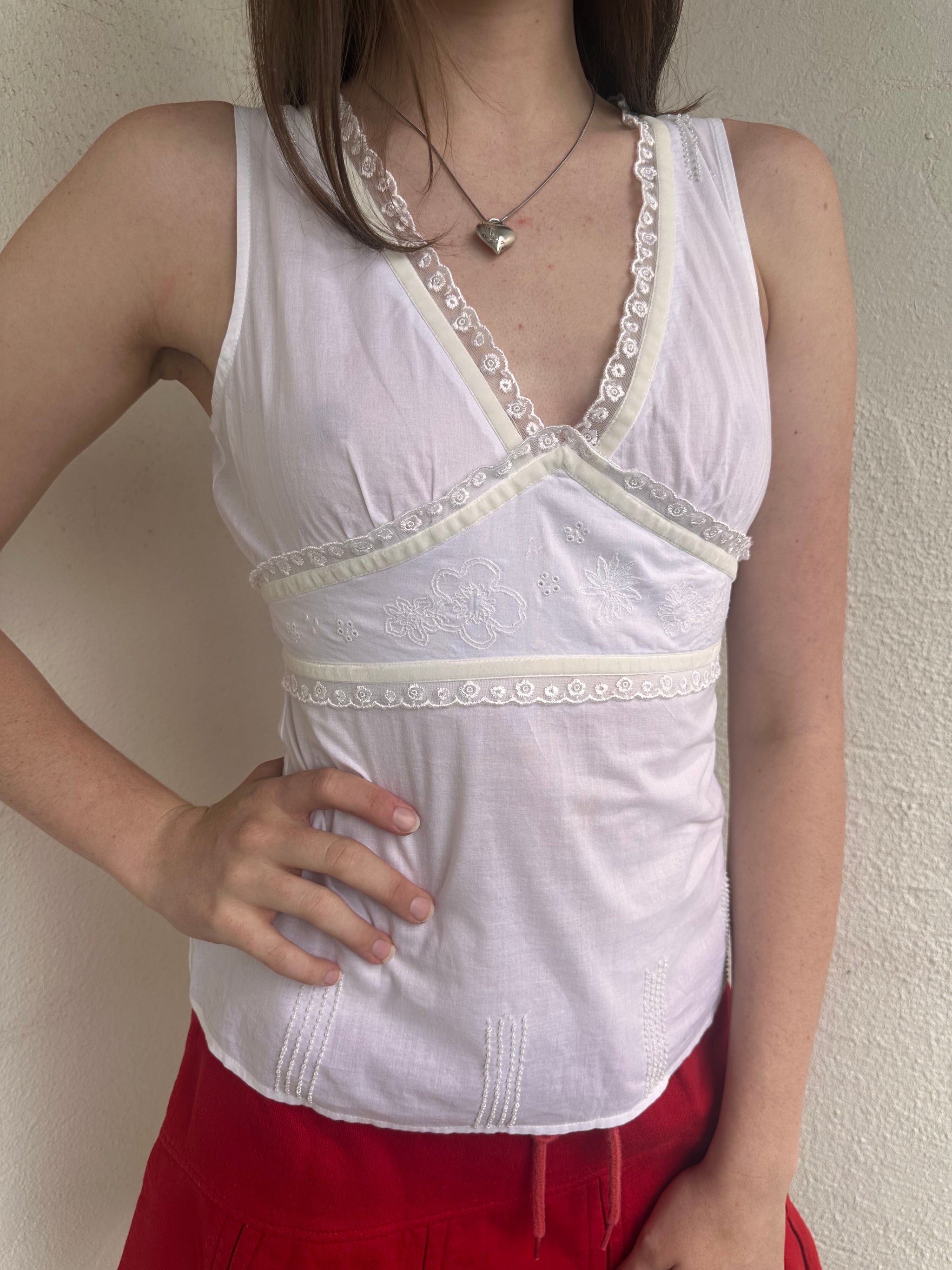 Women wearing a 00s Y2K White lace trim tank top featuring velour ribbon, lace trim and delicate floral embroidery under the bust.
