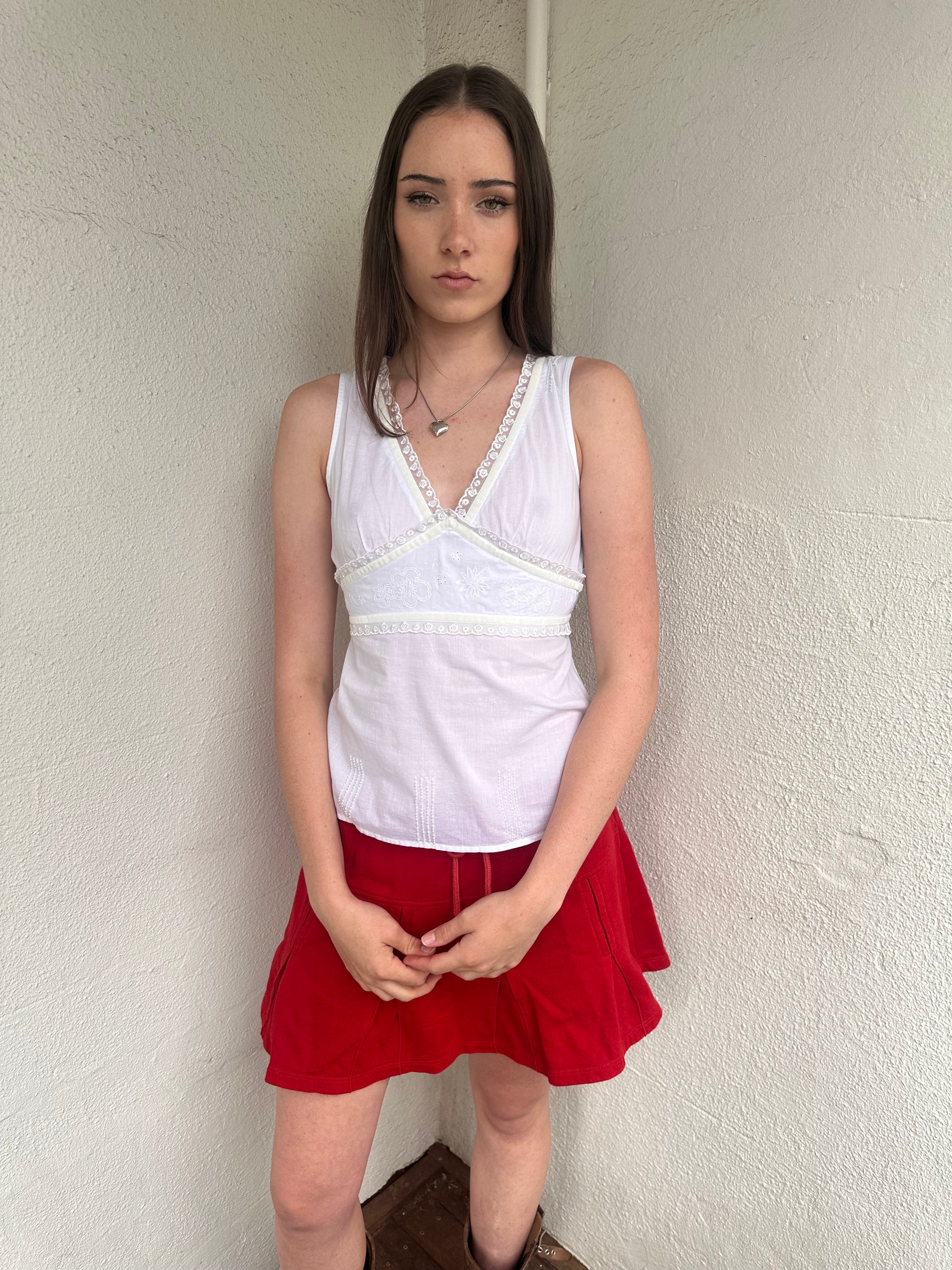 Women wearing a 00s Y2K White lace trim tank top featuring velour ribbon, lace trim and delicate floral embroidery under the bust.