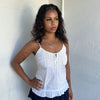 Woman Dressed in Y2K 00s White light cotton cami with a soft, breathable feel and relaxed silhouette. 