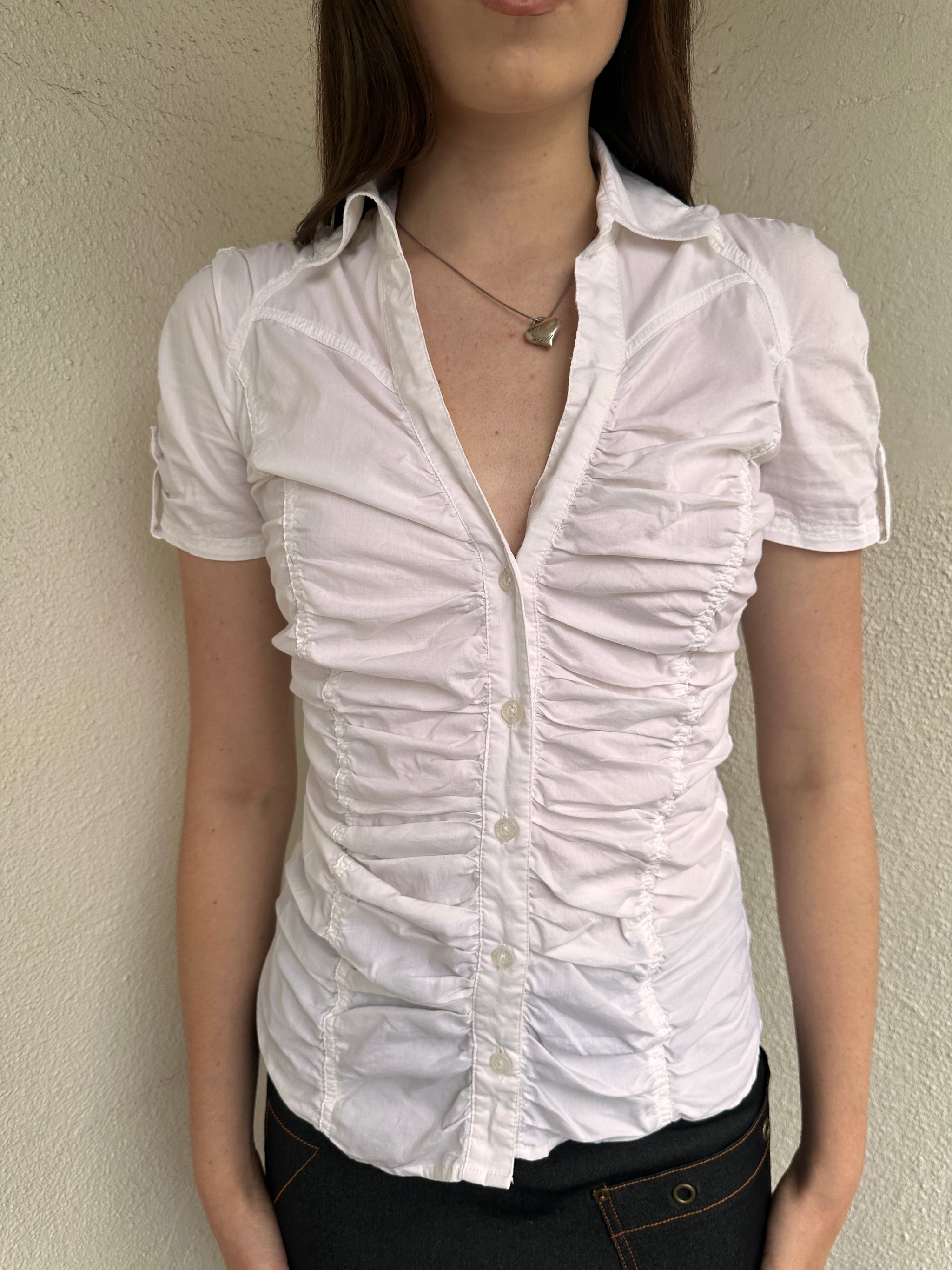 Women wearing a 00s Y2K White ruched textured shirt featuring gathered detailing through the body for a fitted look. 
