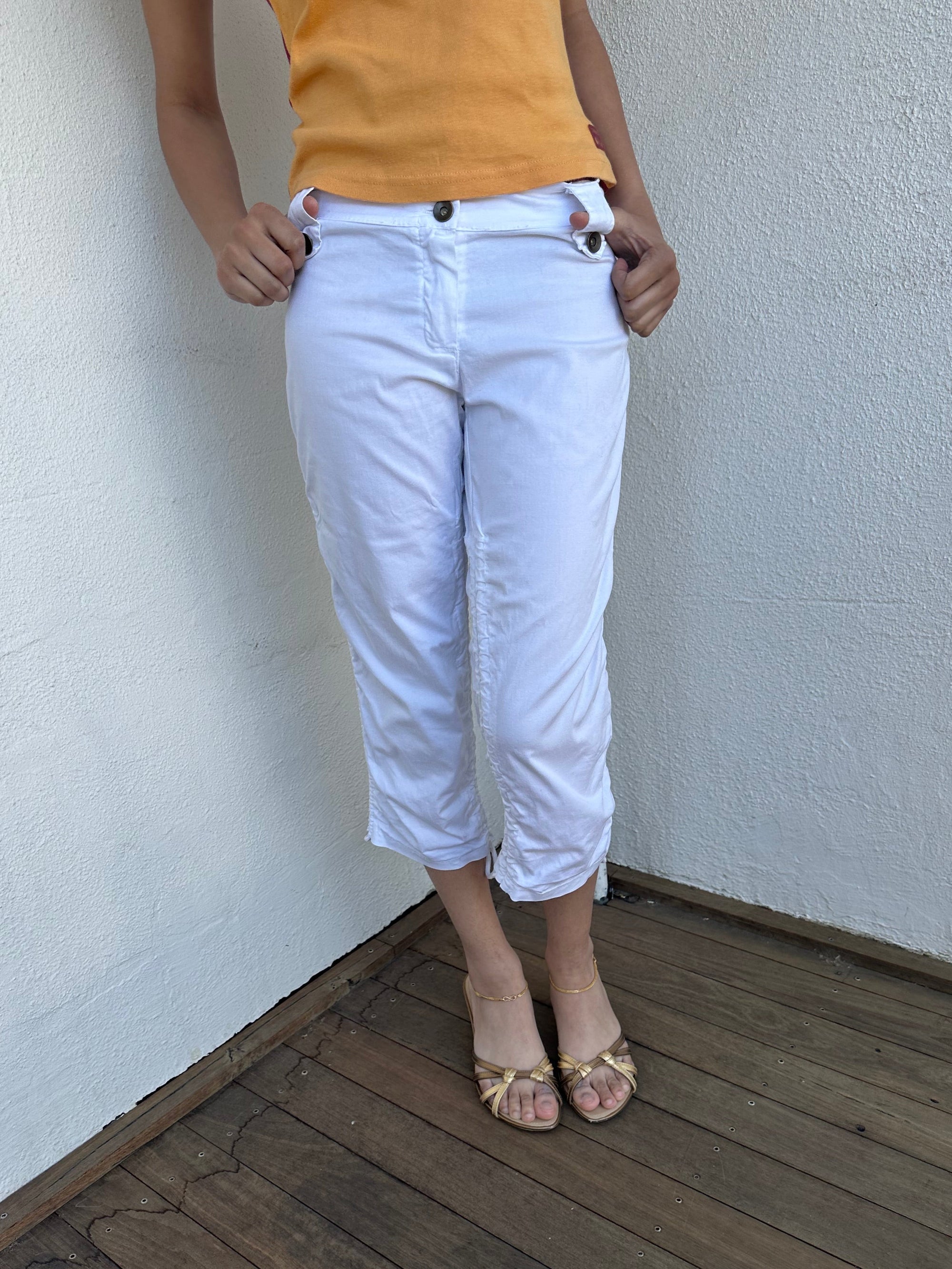 Woman wearing a Y2K 00s White side drawstring capri pants
