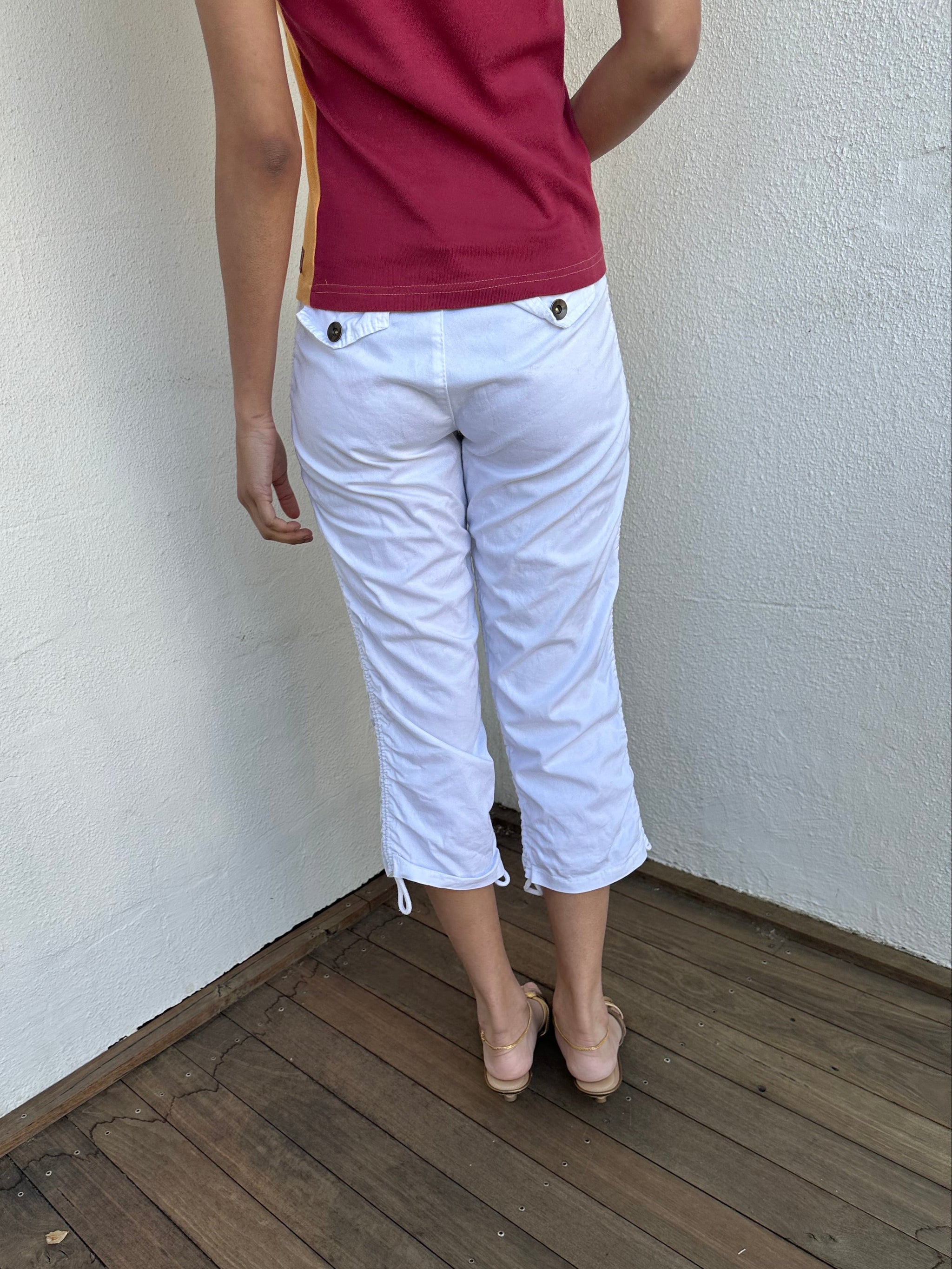 Woman wearing a Y2K 00s White side drawstring capri pants