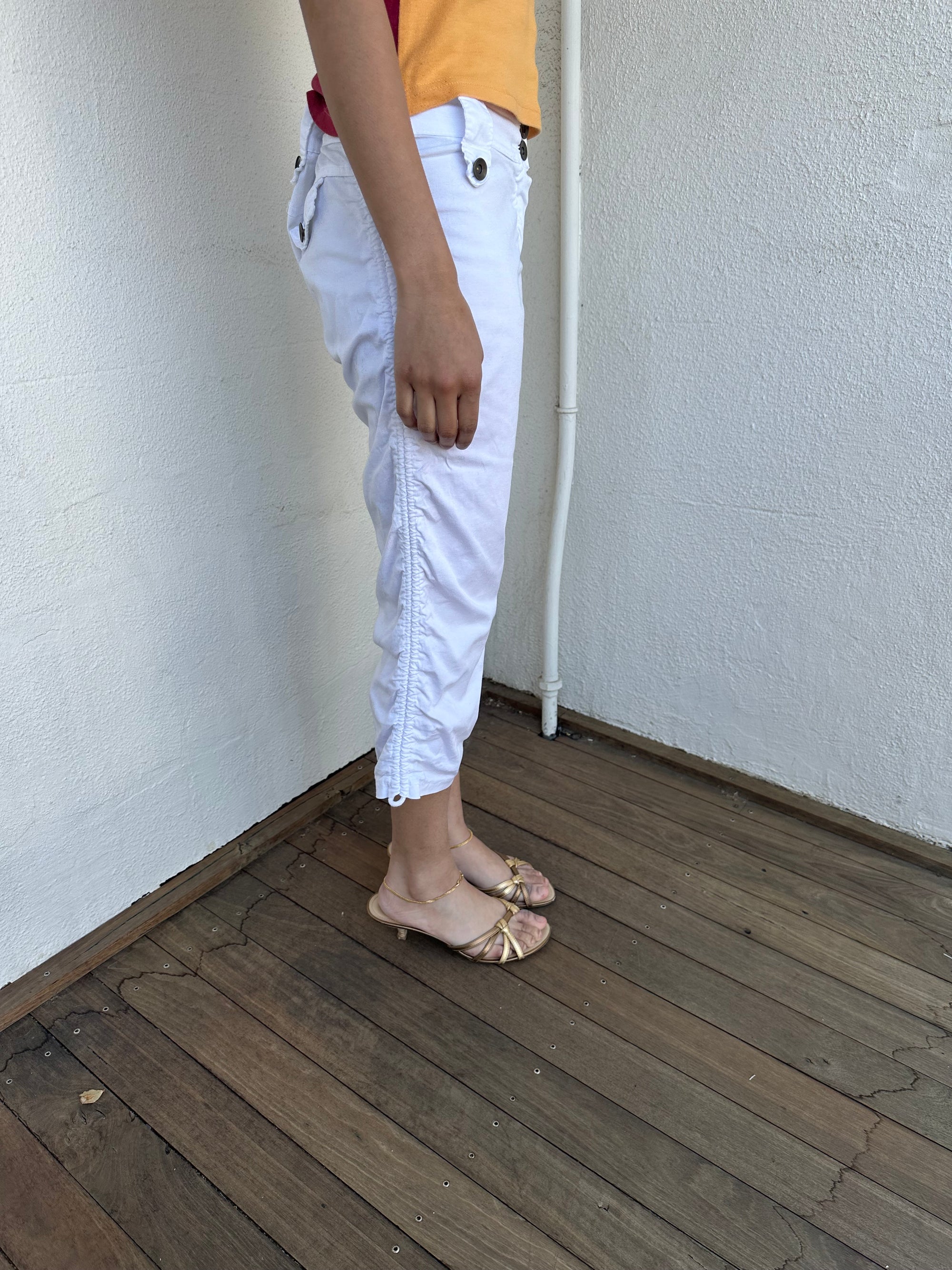 Woman wearing a Y2K 00s White side drawstring capri pants